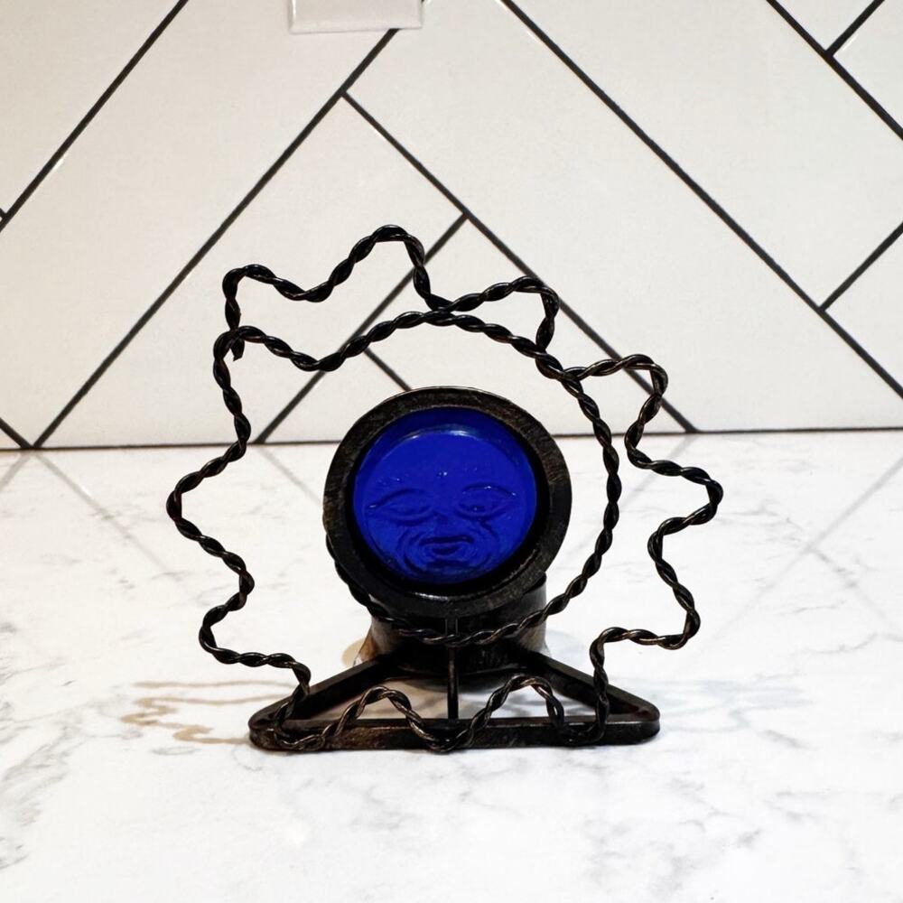celestial 90s sun face candle holder cobalt blue glass face dark wire sunburst
